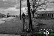 HIA_Utility Pole Broken And Moved To Fence Hurricane Ida